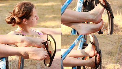 Denise Dangling Flip Flops On Her Bicycle